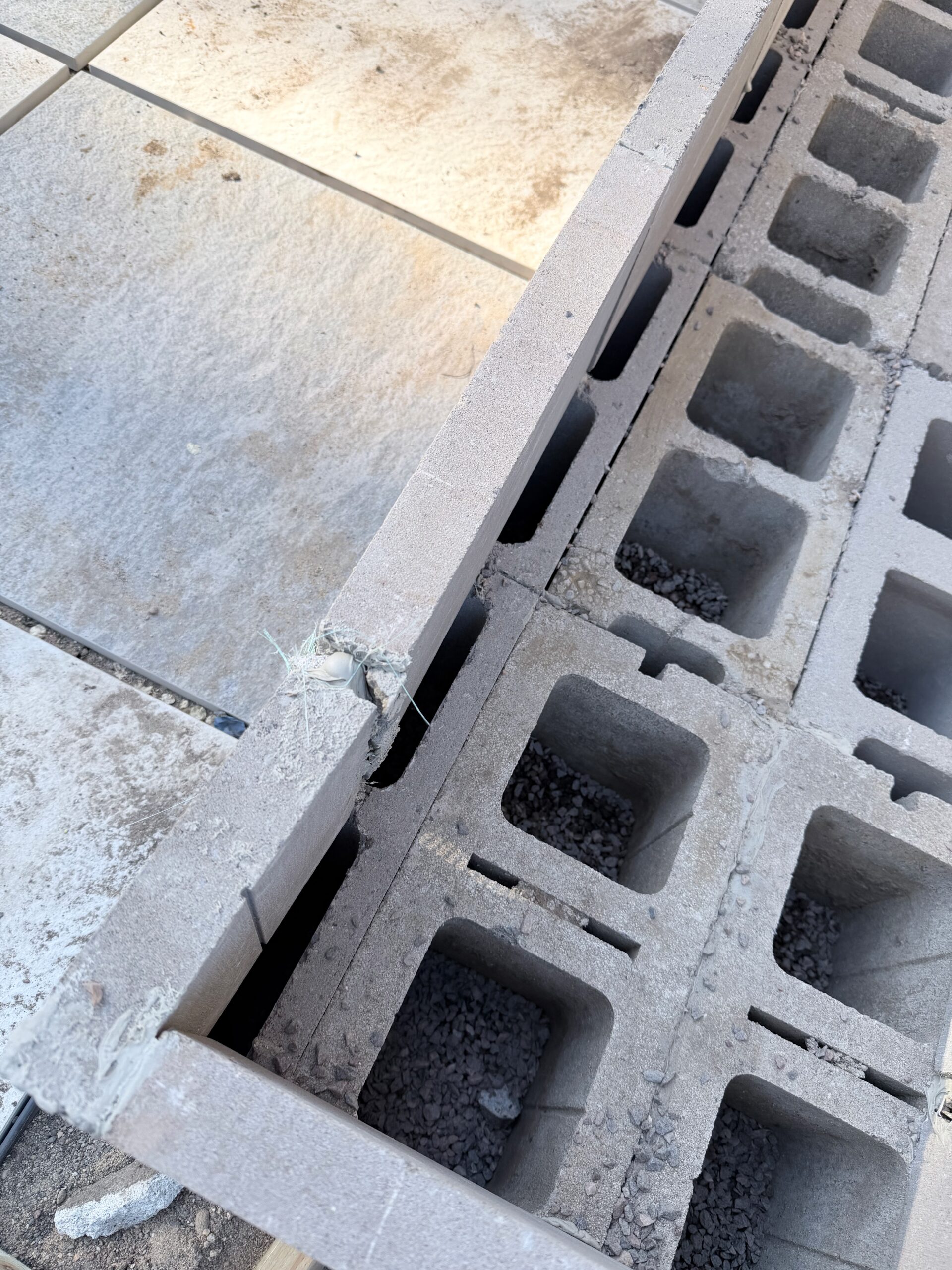 Concrete block work along the edge of the paver base