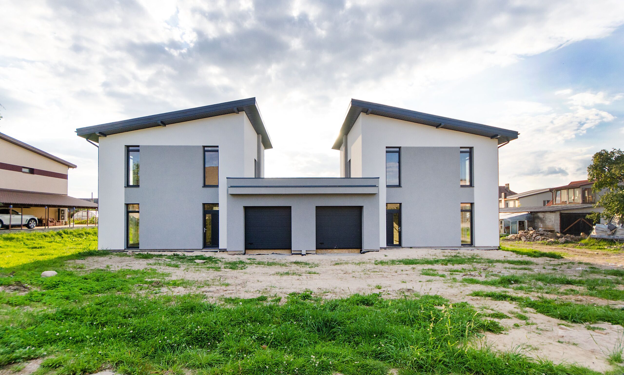 Two symmetrical twin houses side by side
