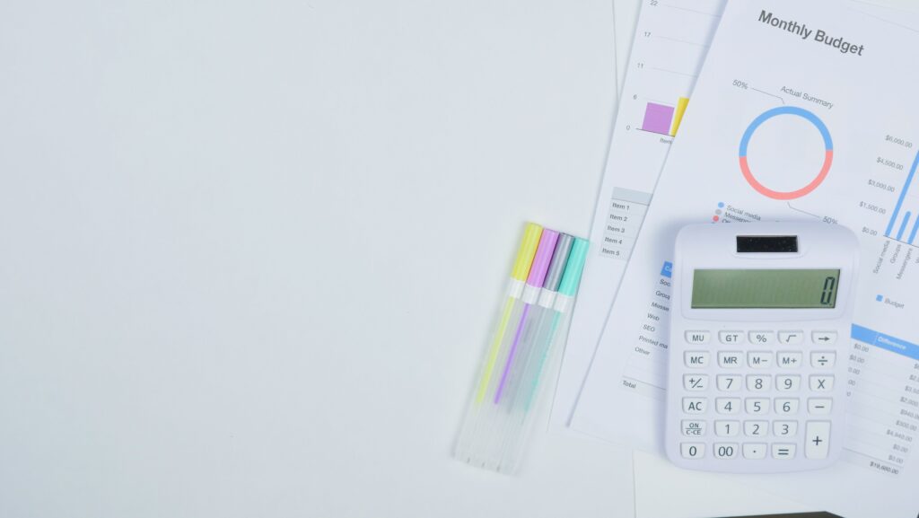 Stock photo flat-lay of a monthly budget planner and calculator
