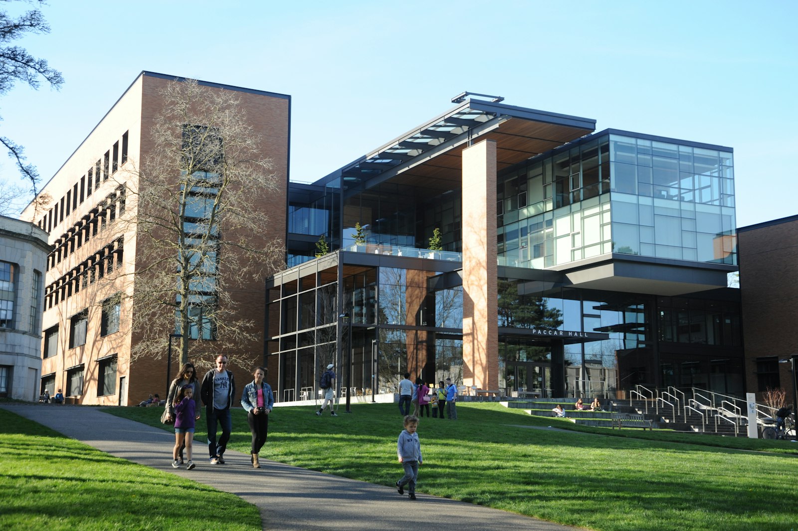 Students walking on a path in front of a university building