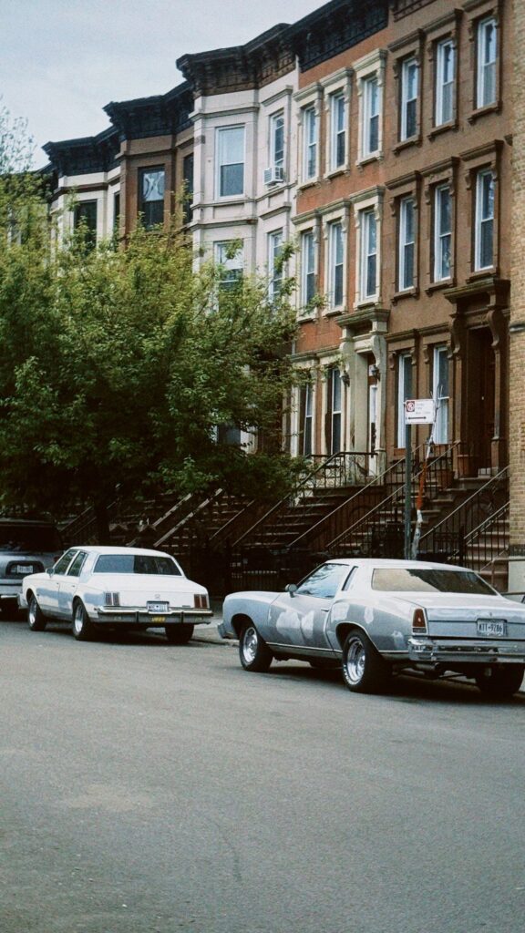 Stock photo of a residential street of brick row homes in Brooklyn