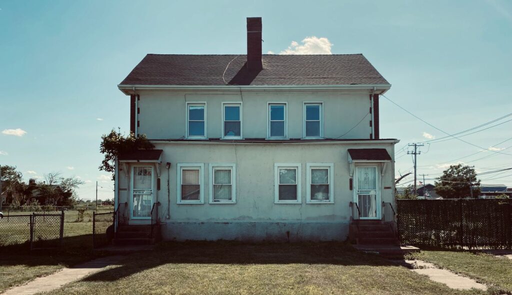 Stock photo of a classic duplex with two front doors