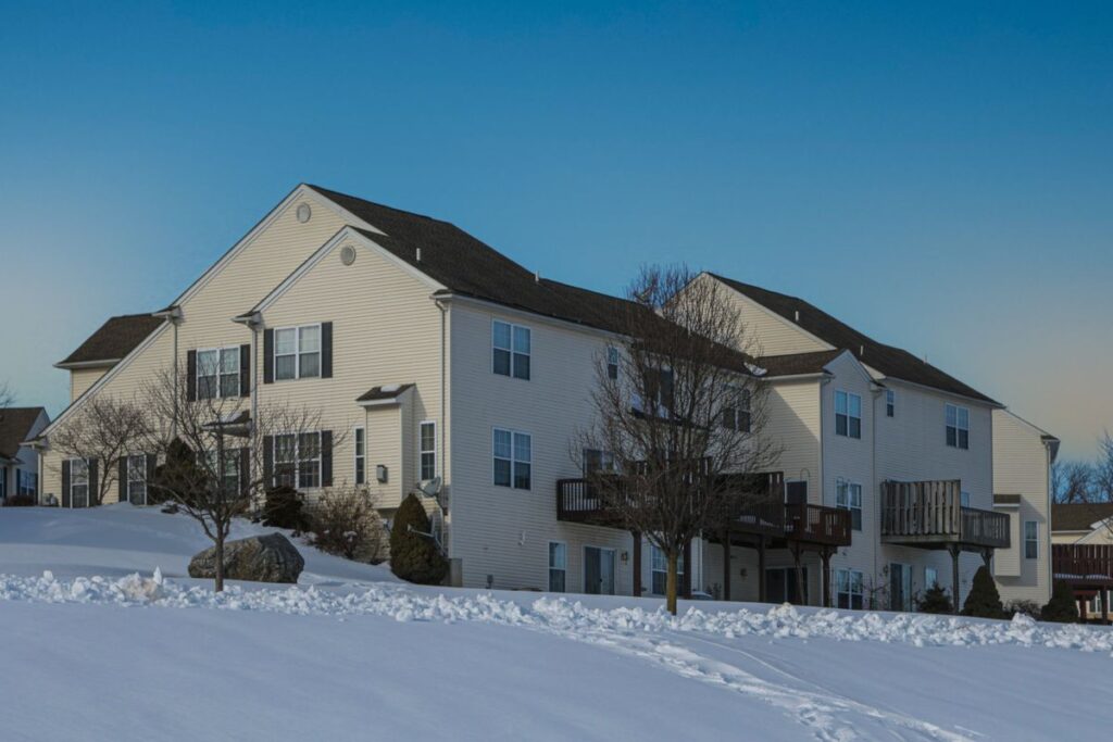 Stock photo of a two-family house on a snowy street in Easton, Pennsylvania