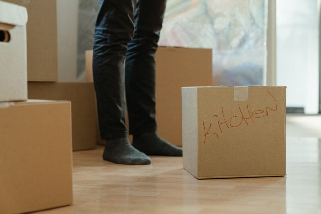 Stock photo of cardboard moving boxes in an empty room