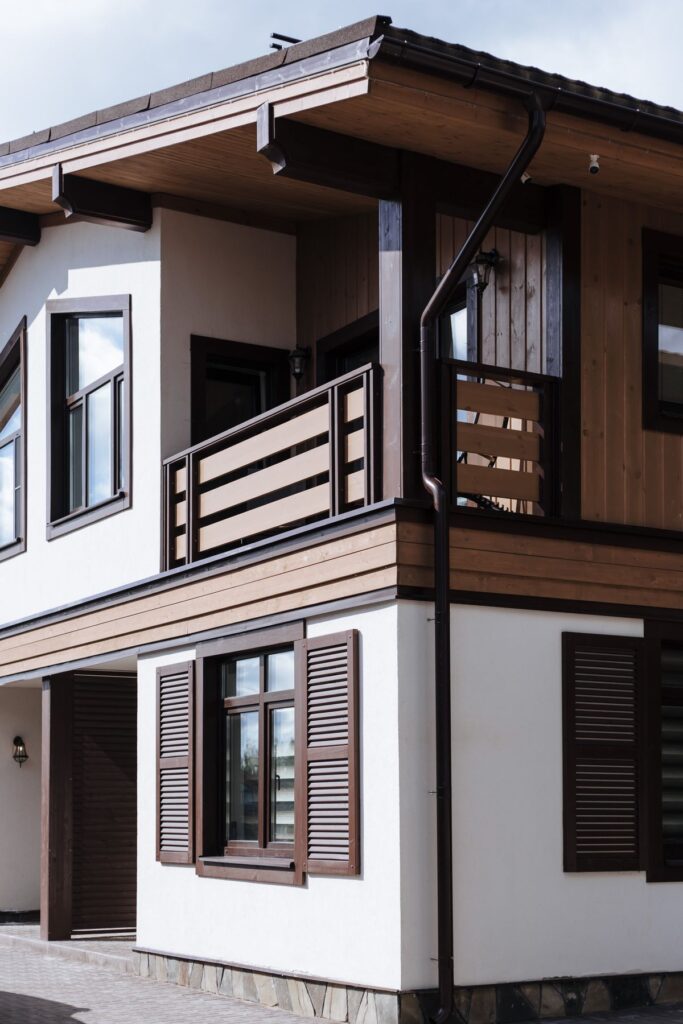 Stock photo of a suburban house with wood accent siding