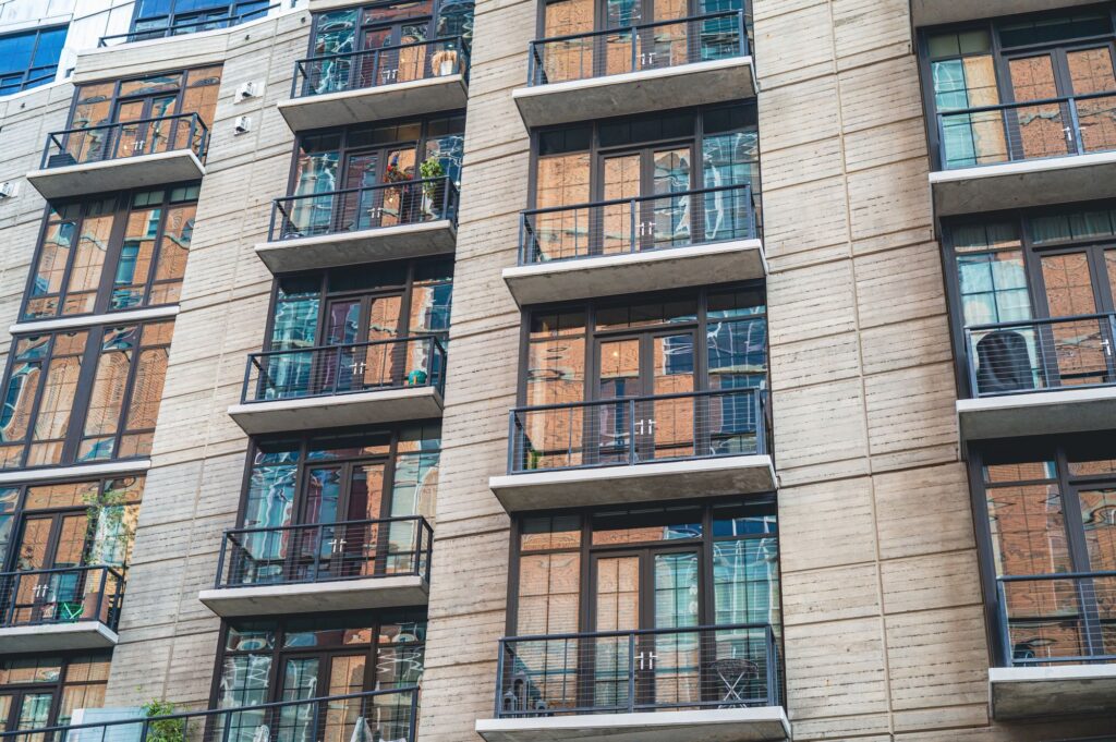 Stock photo of apartment building facade with rows of balconies