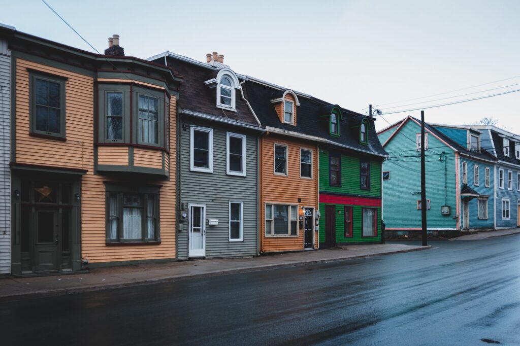Stock photo of colorful wooden rowhouses on a wet street
