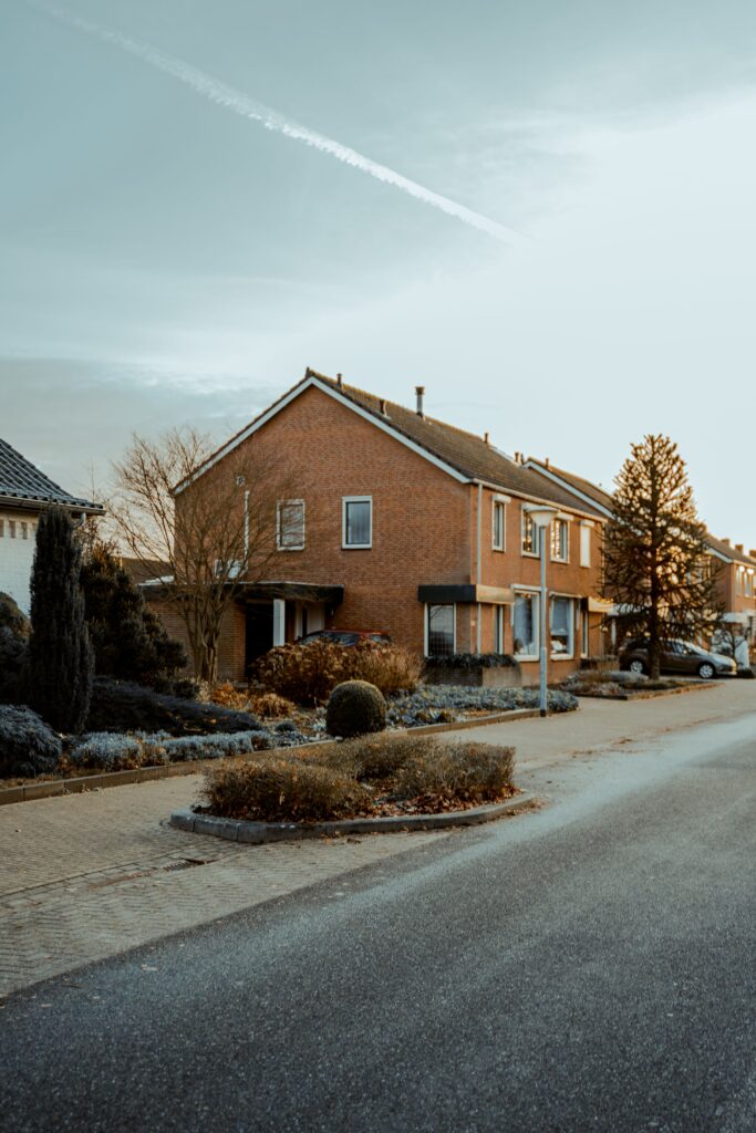Row of brick houses lining a quiet residential street in Missouri