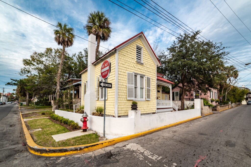 Small yellow house on a quiet street corner in St. Augustine, Florida