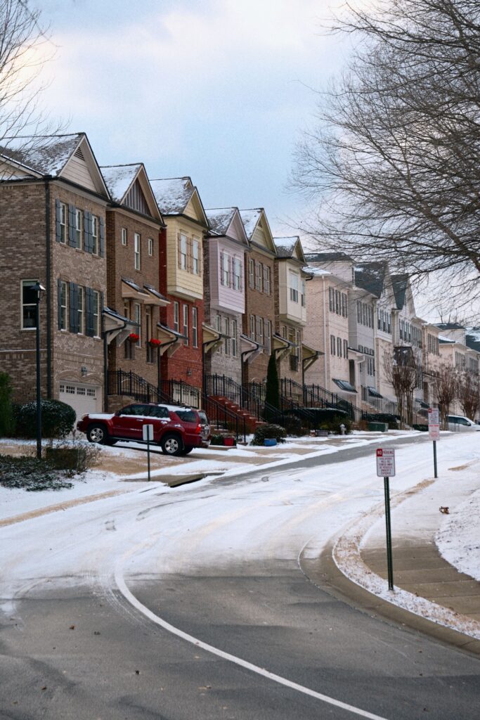 Row of colorful townhouses on a snow-covered street in Atlanta, Georgia